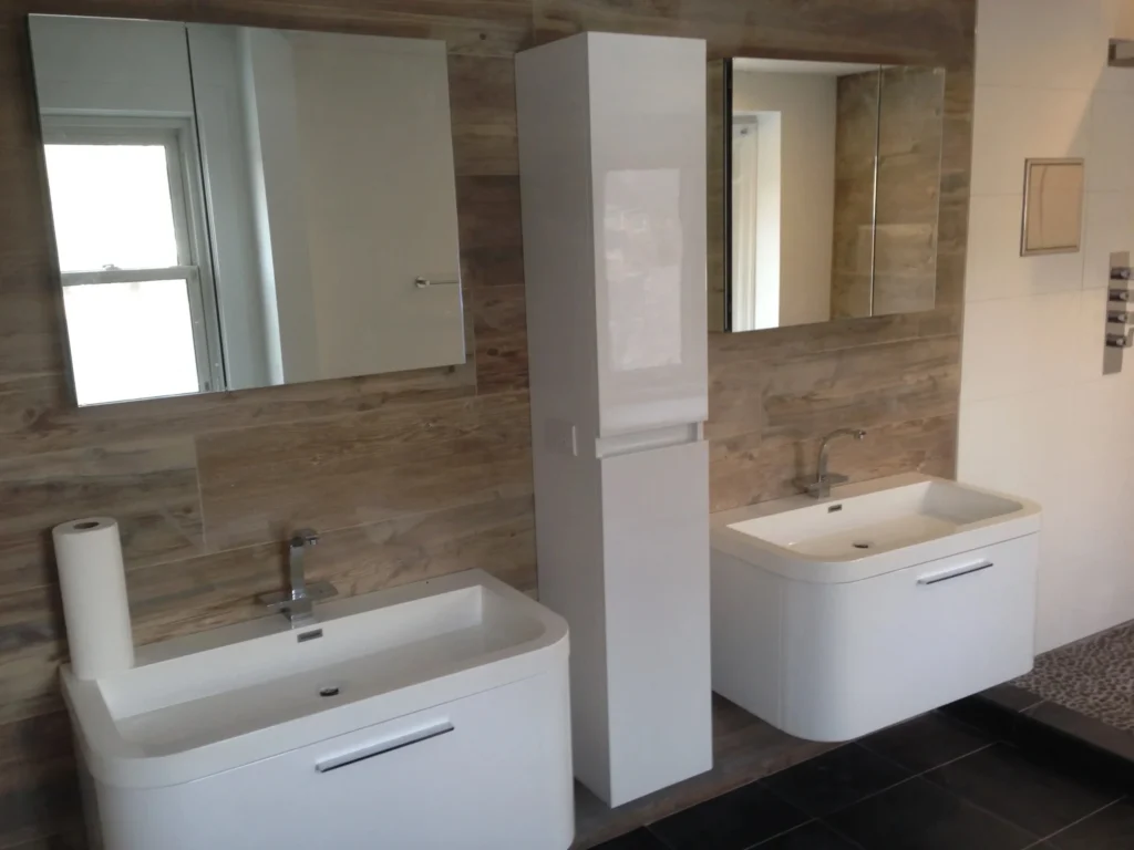 Raakss Reno - Bathroom Renovation with his and her floating sinks and mirror cabinets