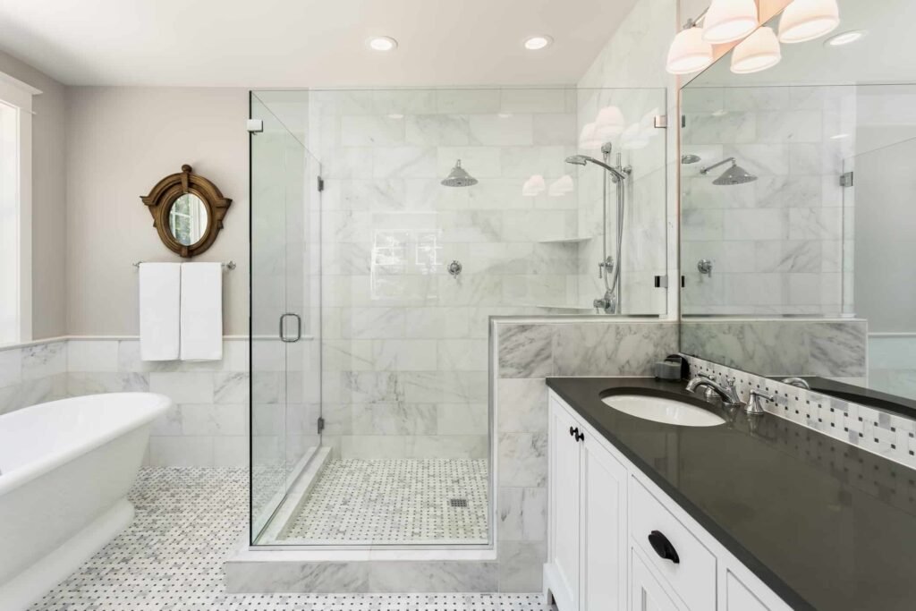 Modern bathroom with ceramic tile and shower walls, glass shower door